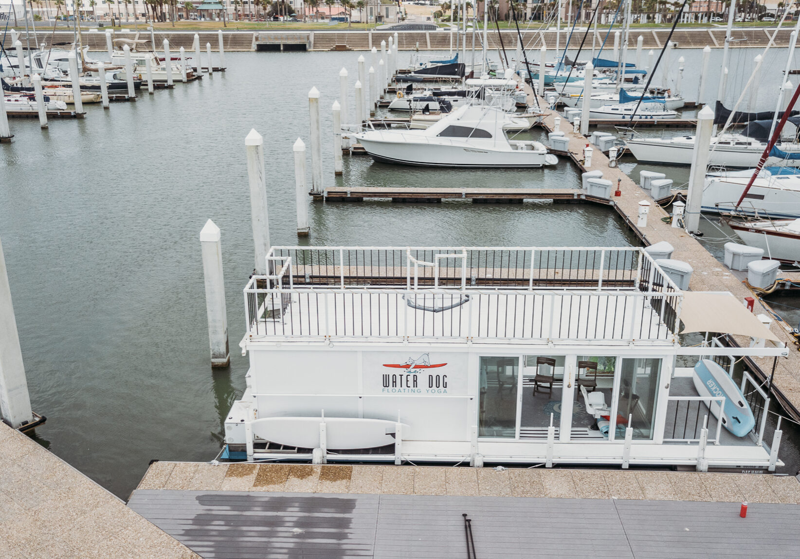 Yoga on the deck of the houseboat studio in the Corpus Christi Marina